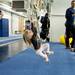 Michigan fan Breana Bottom, 2, hangs on rings during halftime of the game against Princeton on Sunday, April 28. Daniel Brenner I AnnArbor.com